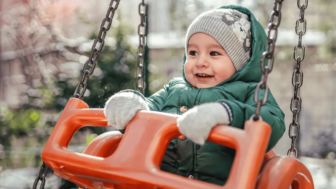 Child Swinging in Cold Weather