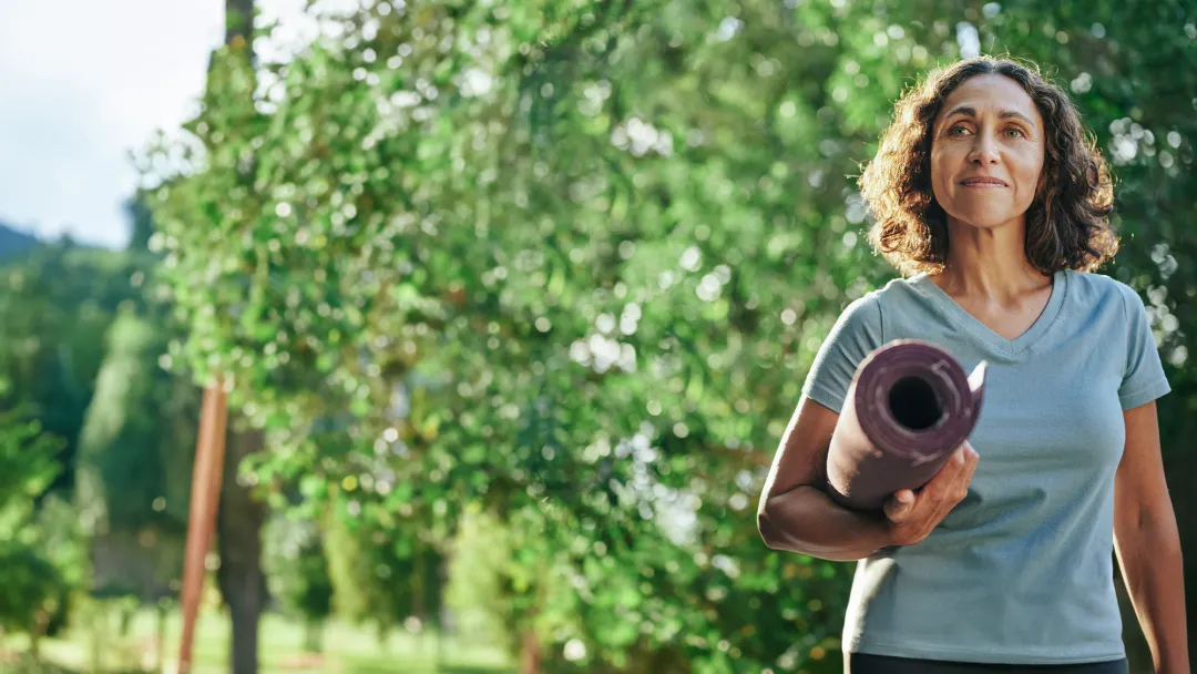 Woman With Yoga Mat Outside