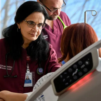 Doctor and Nurse Helping Patient at ER