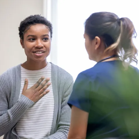 Woman Talking to Doctor About Personal Medical Issue