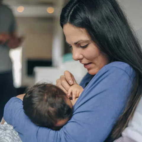 Mother breastfeeding child