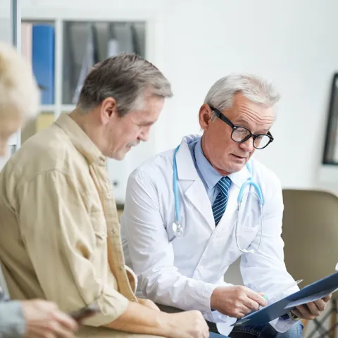 Physician talking to patient about test results.