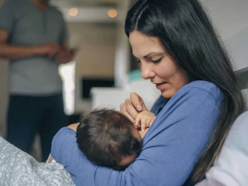 Mother breastfeeding child