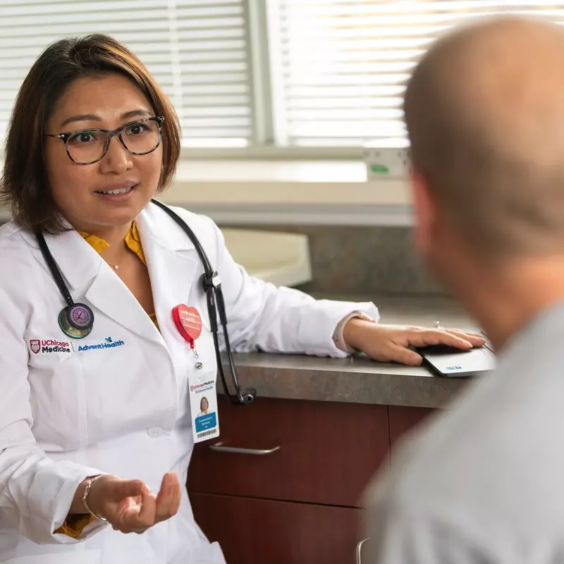Physican Speaking to Patient in Medical Office