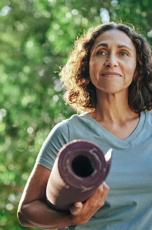 Woman With Yoga Mat Outside