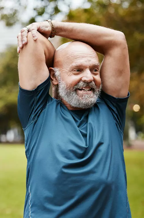 Senior Man Stretching Outdoors